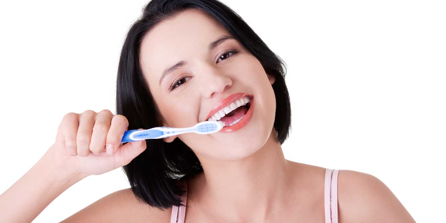 Girl is Brushing Her Teeth